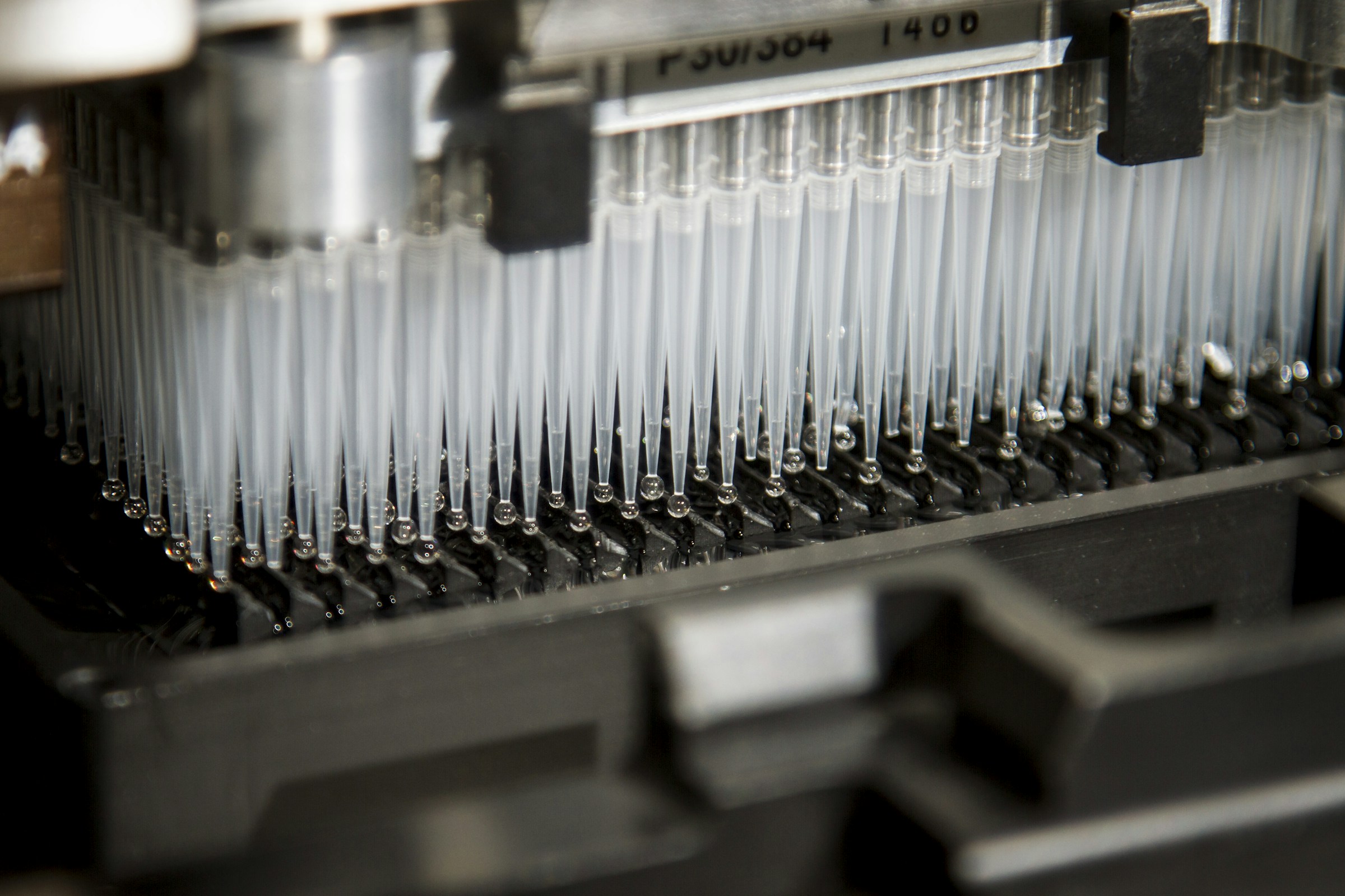 Rows of pipette tips on an automated liquid-handling robot at the National Cancer Institute’s Cancer Genomics Research Laboratory.